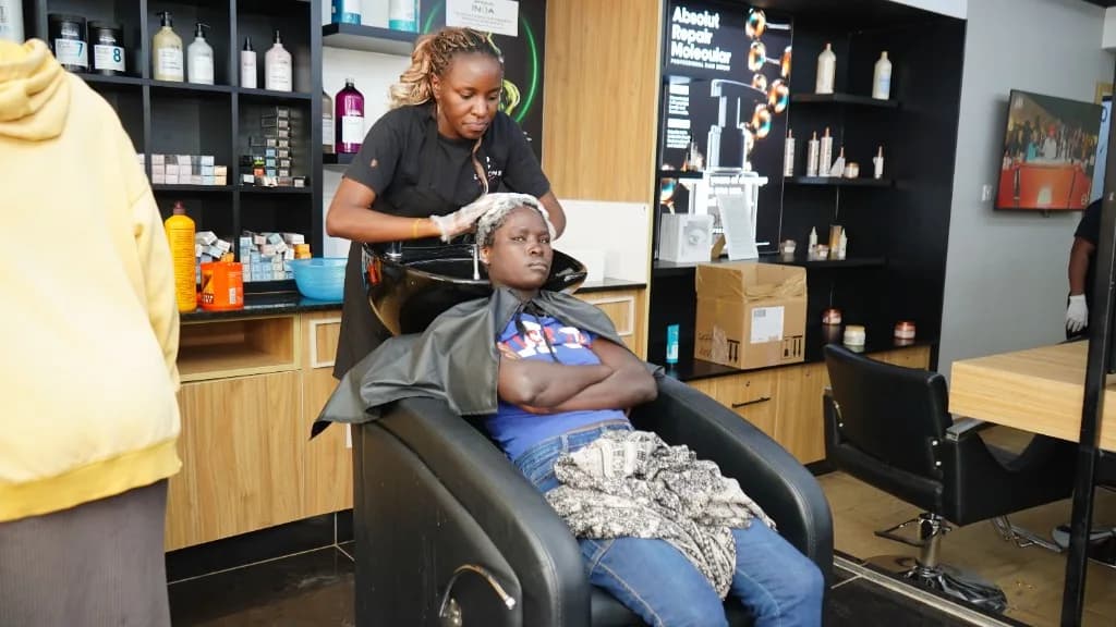 A guest receiving a hair treatment